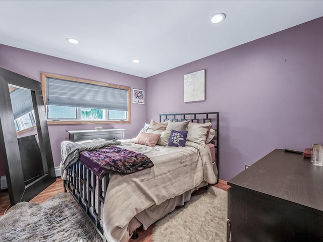 bedroom with hardwood / wood-style floors