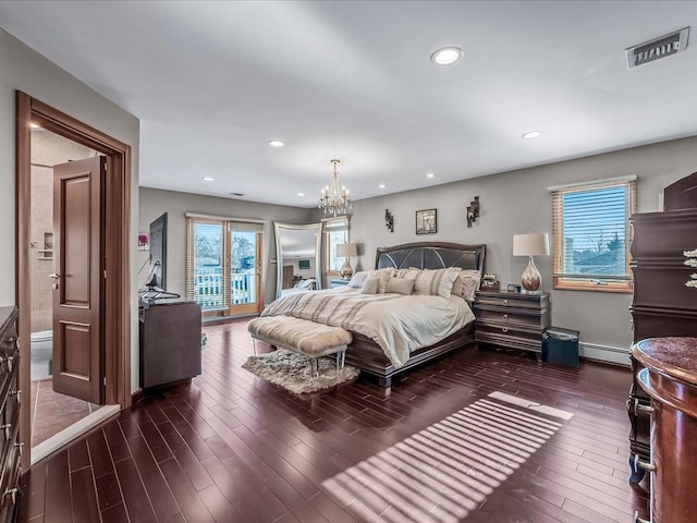 bedroom with a chandelier, access to outside, and a baseboard radiator