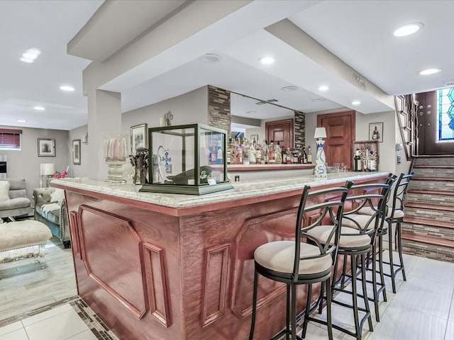 bar with light tile patterned floors