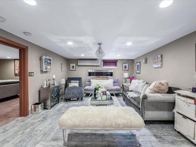 living room with hardwood / wood-style flooring and a wall unit AC