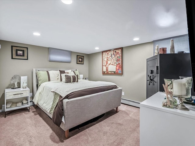 carpeted bedroom featuring baseboard heating