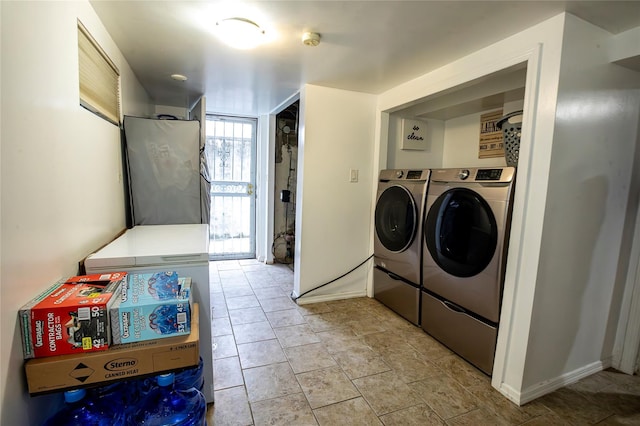 laundry room with washing machine and dryer