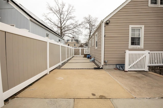 view of side of property featuring a patio