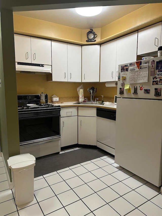 kitchen with sink, white appliances, and white cabinetry