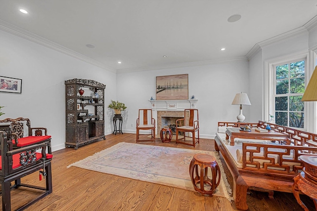 interior space with light hardwood / wood-style floors and ornamental molding