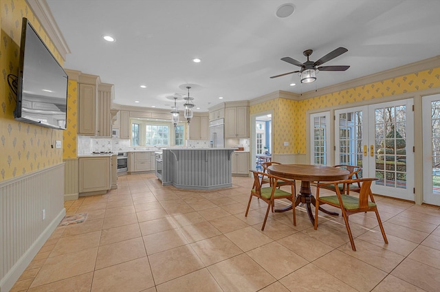 dining room with ceiling fan, french doors, light tile patterned flooring, and crown molding