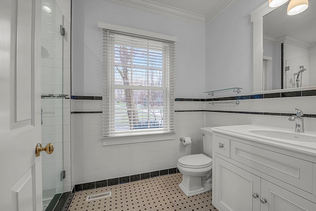 bathroom featuring a wealth of natural light, ornamental molding, tile walls, and walk in shower