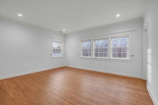 unfurnished room with light wood-type flooring and ornamental molding