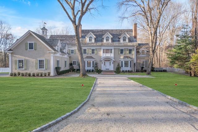 view of front of home with a front lawn