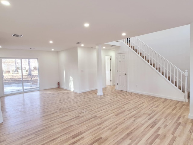 unfurnished living room featuring light hardwood / wood-style flooring