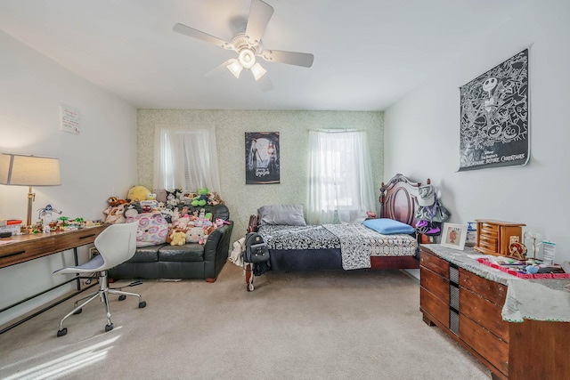 bedroom featuring ceiling fan and light carpet