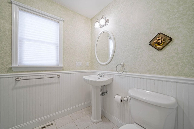 bathroom with sink, tile patterned floors, and toilet