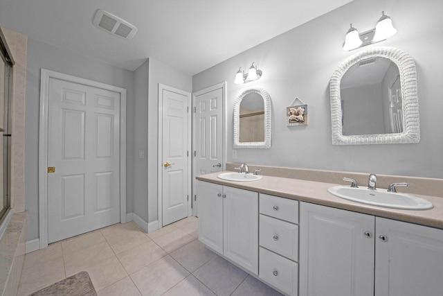 bathroom featuring vanity and tile patterned flooring