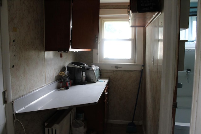 kitchen with dark brown cabinetry