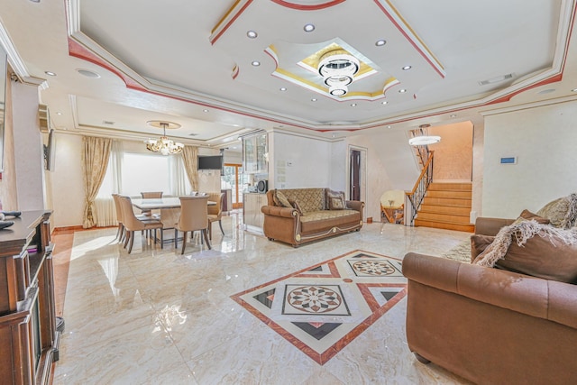 living room featuring crown molding, an inviting chandelier, and a tray ceiling