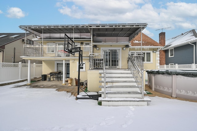 view of snow covered house