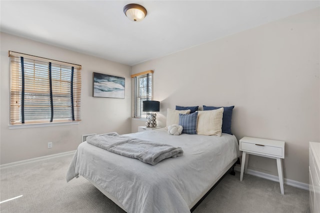 bedroom with carpet and baseboards