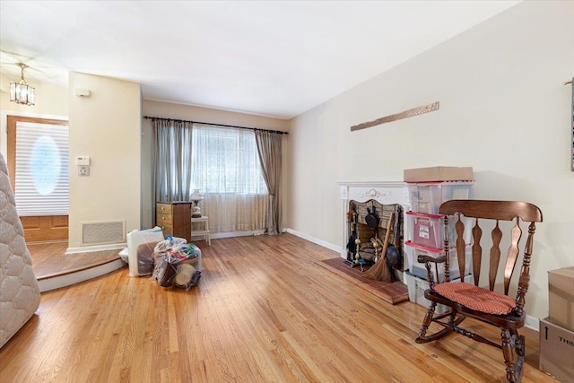 living area with hardwood / wood-style flooring