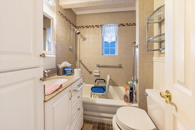 full bathroom featuring vanity, tiled shower / bath combo, tile patterned floors, and toilet