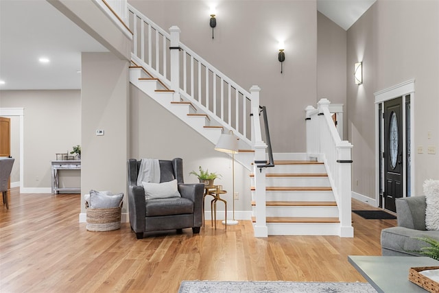 staircase with hardwood / wood-style floors