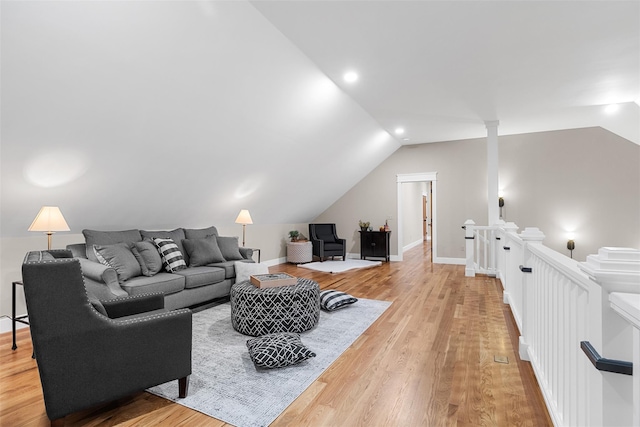 living room with lofted ceiling and light hardwood / wood-style floors