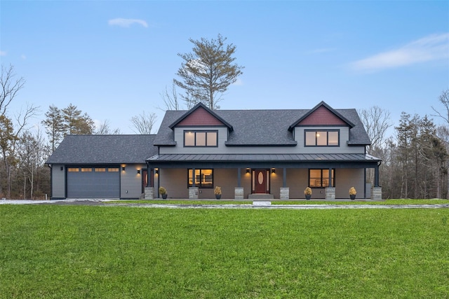 view of front of house with a front lawn, a porch, and a garage