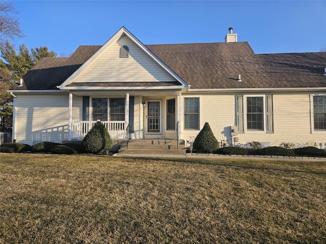 view of front of home featuring a front lawn and covered porch