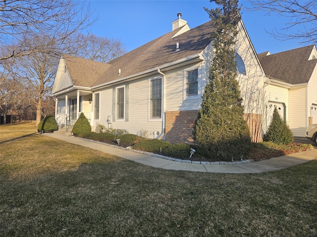 view of property exterior with a garage and a yard