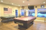 recreation room with billiards and light wood-type flooring