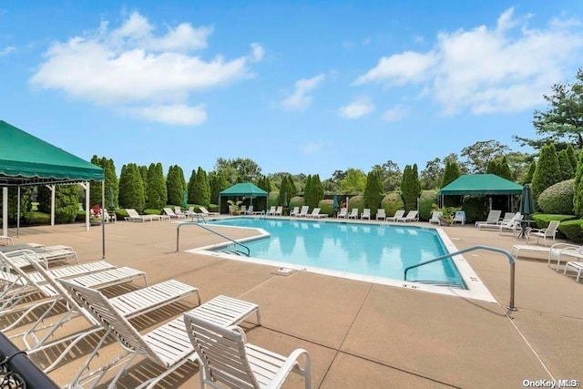 view of pool featuring a gazebo and a patio