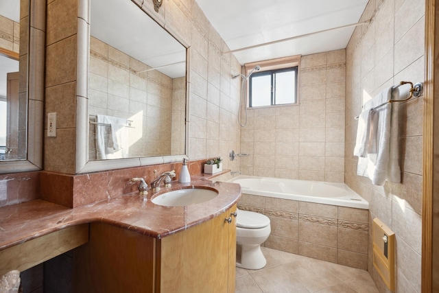 bathroom featuring tile walls, tile patterned floors, vanity, and toilet