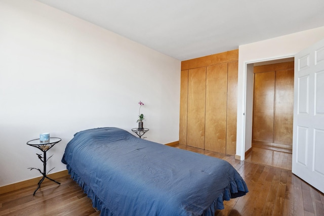 bedroom with hardwood / wood-style flooring