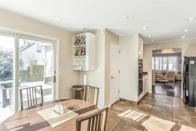 dining area with a healthy amount of sunlight and light tile patterned floors