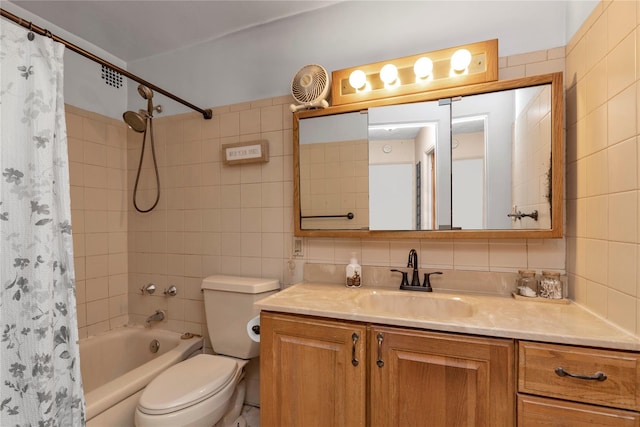 full bathroom with shower / tub combo with curtain, toilet, tile walls, vanity, and backsplash