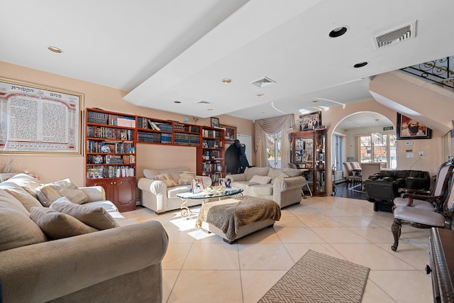 138-65 63rd Ave, Flushing, NY 11367 - living room featuring arched walkways, light tile patterned floors, and recessed lighting