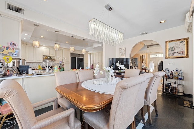 138-65 63rd Ave, Flushing, NY 11367 - dining space featuring arched walkways, a chandelier, and recessed lighting