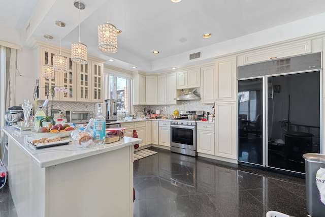 138-65 63rd Ave, Flushing, NY 11367 - kitchen with high end black fridge, stainless steel gas stove, under cabinet range hood, a chandelier, and light countertops