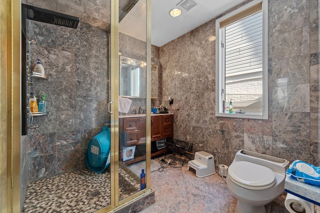 138-65 63rd Ave, Flushing, NY 11367 - bathroom with a stall shower, toilet, vanity, and tile walls