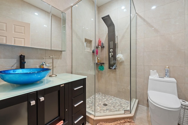 138-65 63rd Ave, Flushing, NY 11367 - full bathroom with tile walls, a stall shower, vanity, and toilet
