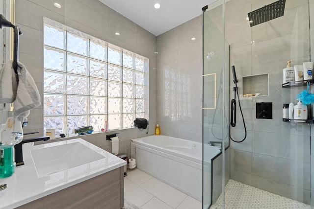 138-65 63rd Ave, Flushing, NY 11367 - full bathroom with healthy amount of natural light, tile patterned floors, a walk in shower, a bath, and tile walls