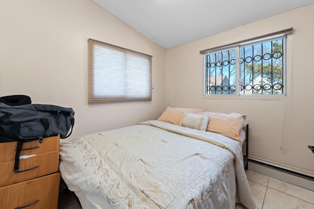 138-65 63rd Ave, Flushing, NY 11367 - bedroom with lofted ceiling, a baseboard heating unit, and tile patterned flooring