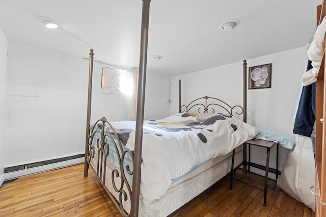 138-65 63rd Ave, Flushing, NY 11367 - bedroom with wood-type flooring and a baseboard heating unit