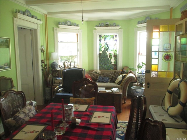 interior space featuring hardwood / wood-style flooring and ornamental molding