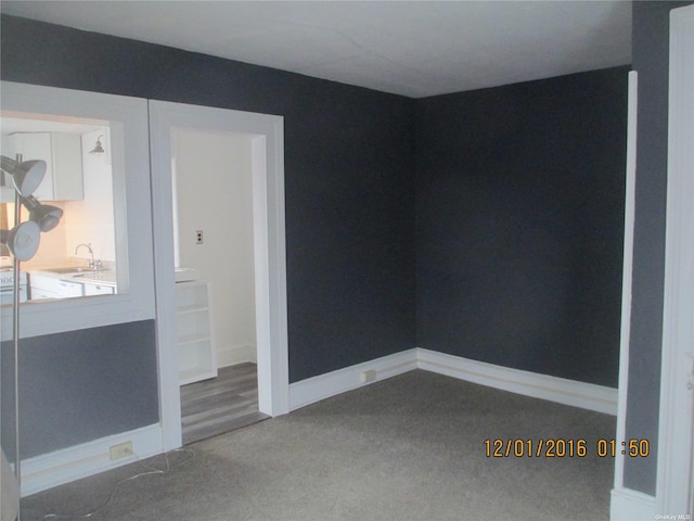 empty room featuring carpet and sink