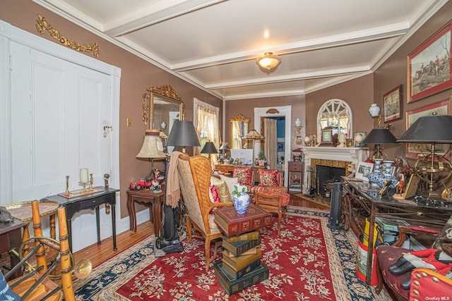 living room featuring wood-type flooring, a fireplace, and beamed ceiling