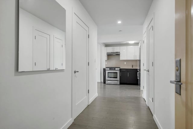 corridor featuring dark hardwood / wood-style flooring