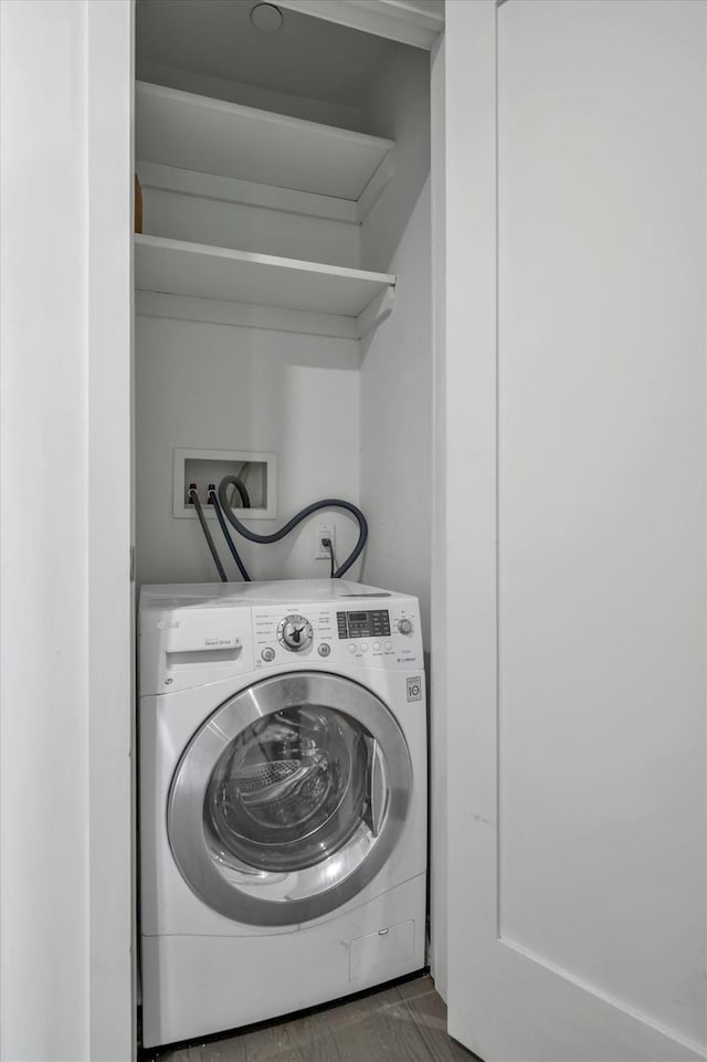 laundry room with washer / dryer