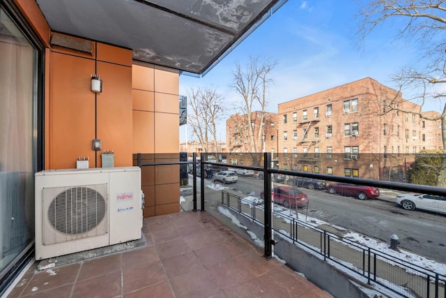 balcony featuring ac unit