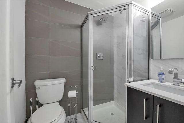 43-12 214th Pl Unit 2A, Bayside, NY 11361 - full bath with vanity, a stall shower, toilet, visible vents, and tile walls
