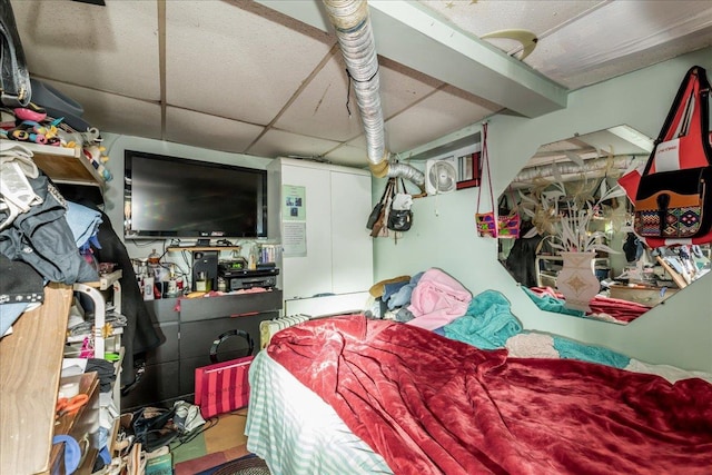 bedroom featuring a drop ceiling